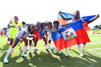 AUCKLAND, NEW ZEALAND - FEBRUARY 22: Haiti celebrate qualification for the 2023 FIFA Women's World Cup after their victory in the 2023 FIFA World Cup Play Off Tournament match between Chile and Haiti at North Harbour Stadium on February 22, 2023 in Auckland, New Zealand. (Photo by Hannah Peters - FIFA/FIFA via Getty Images)