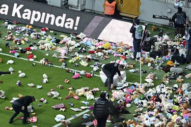 ISTANBUL, TURKIYE - FEBRUARY 26: Teddy bears and toys thrown on the field to be sent to the earthquake zone of the Vodafone Park Stadium prior to the Turkish Super Lig soccer match between Besiktas and Fraport TAV Antalyaspor, in Istanbul, Turkiye on February 26, 2023. On Feb.6 a strong 7.7 earthquake, centered in the Pazarcik district, jolted Kahramanmaras and strongly shook several provinces, including Gaziantep, Sanliurfa, Diyarbakir, Adana, Adiyaman, Malatya, Osmaniye, Hatay, and Kilis. On the same day at 1.24 p.m. (1024GMT), a 7.6 magnitude quake centered in Kahramanmaras' Elbistan district struck the region. (Photo by Serhat Cagdas/Anadolu Agency via Getty Images)