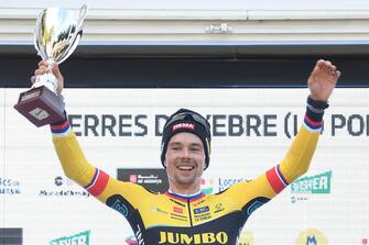 The leader of the general classification, Team Jumbo-Visma's Slovenian rider Primoz Roglic, celebrates on the podium winning the 5th stage of the 2023 Volta Catalunya cycling tour of Catalonia, a 176,5 km race from Tortorsa to Lo Port, in Roquetes, on March 24, 2023. (Photo by Josep LAGO / AFP) (Photo by JOSEP LAGO/AFP via Getty Images)