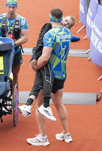 Rob Burrow and Kevin Sinfield cross the finish line of the 2023 Rob Burrow Leeds Marathon which started and finished at Headingley Stadium, Leeds. Picture date: Sunday May 14, 2023. (Photo by Danny Lawson/PA Images via Getty Images)