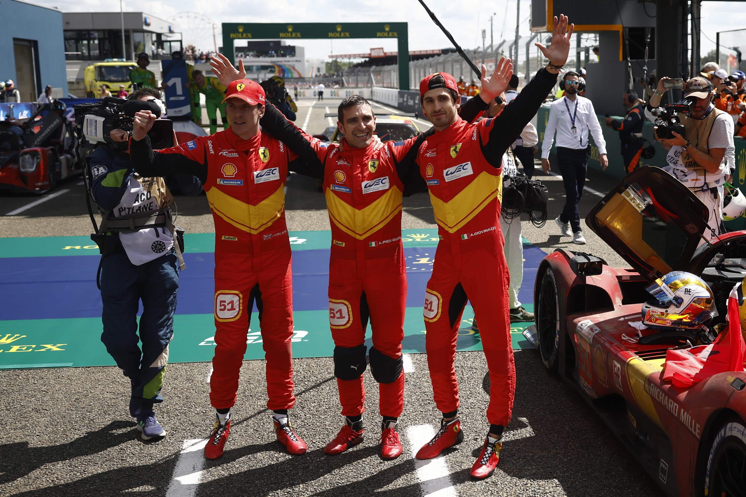 epa10685355 Ferrari AF Corse Italy team car with Alessandro Guidi (C) of Italy, James Palado (L) of Britain and Antonio Giovinazzi (R) of Italy celebrate winning the 24 Hours of Le Mans Centenary, the 91st edition of the race in Le Mans, France, 11 June 2023.  EPA/YOAN VALAT