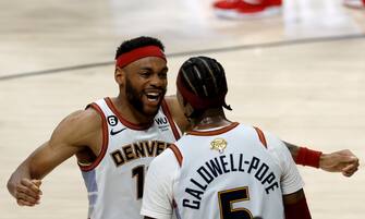 epa10687807 Denver Nuggets forward Bruce Brown (L) and Denver Nuggets guard Kentavious Caldwell-Pope (R) celebrate following the Nuggets win over the Miami Heat to win the NBA championships at Ball Arena in Denver, Colorado, USA, 12 June 2023.  EPA/JOHN G. MABANGLO  SHUTTERSTOCK OUT