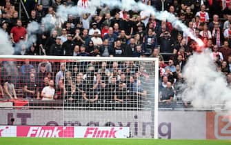 AMSTERDAM - The match is stopped for the second time due to fireworks on the field during the Dutch Eredivisie match between Ajax and Feyenoord at the Johan Cruijff ArenA on September 24, 2023 in Amsterdam, the Netherlands. ANP OLAF KRAAK (Photo by ANP via Getty Images)