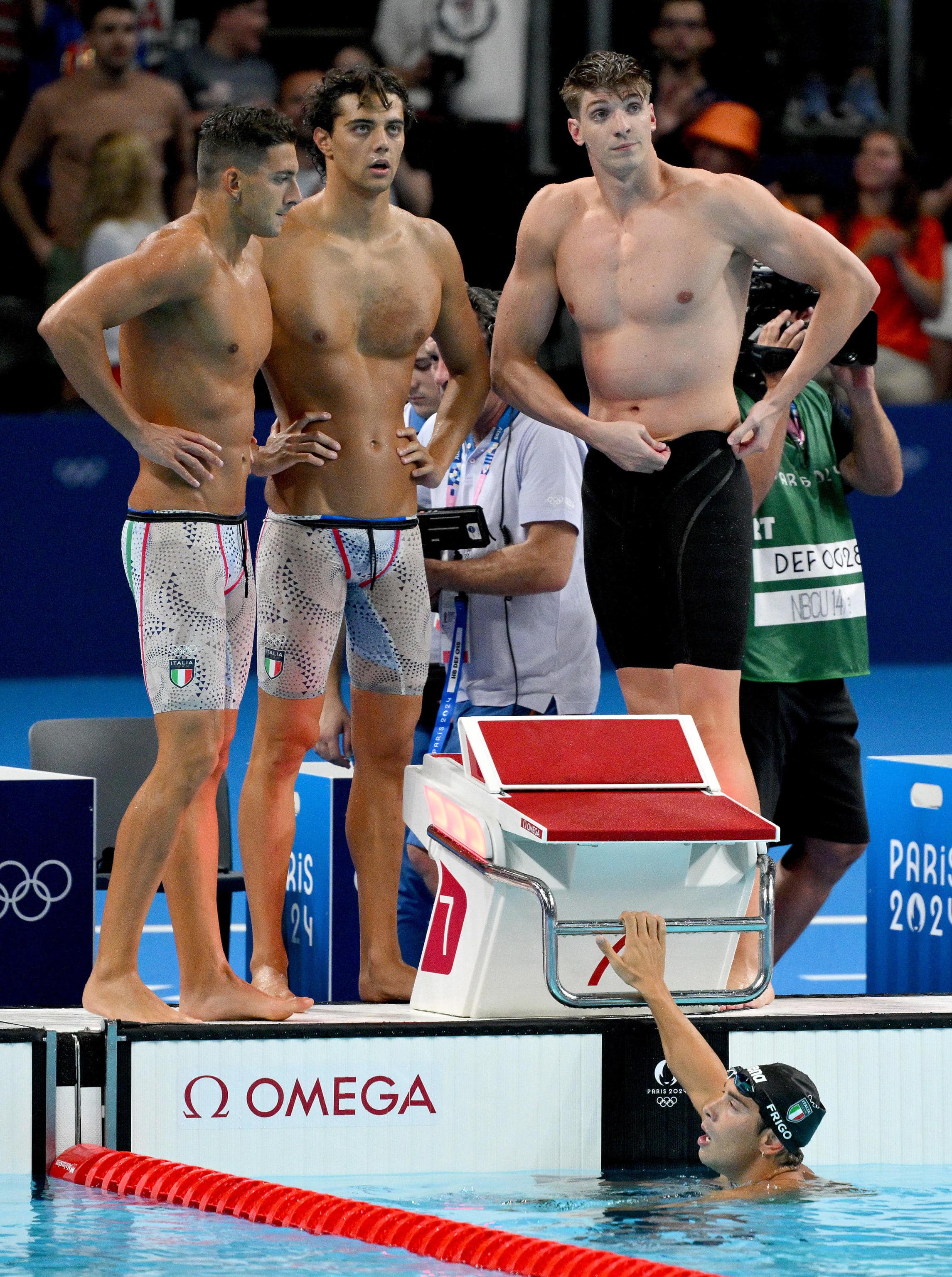 (L-R) Italian Paolo Conte Bonin, Thomas Ceccon, Alessandro Miressi and Manuel Frigo celebrate after winning the bronze medal in the Men's 4x100m Freestyle Relay Final of the Swimming competitions during the Paris 2024 Olympic Games at the Paris La Defense Arena in Paris, France, 27 July 2024. Summer Olympic Games will be held in Paris from 26 July to 11 August 2024.   ANSA/ETTORE FERRARI
