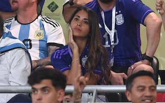 epa10346609 Antonella Roccuzzo (C), the wife of Argentina's Lionel Messi, before the FIFA World Cup 2022 round of 16 soccer match between Argentina and Australia at Ahmad bin Ali Stadium in Doha, Qatar, 03 December 2022.  EPA/Neil Hall