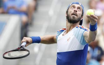 epa07805625 Paolo Lorenzi of Italy serves to Stan Wawrinka of Switzerland during their match on the fifth day of the US Open Tennis Championships the USTA National Tennis Center in Flushing Meadows, New York, USA, 30 August 2019. The US Open runs from 26 August through 08 September.  EPA/JUSTIN LANE