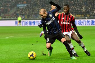 AC Milan's French defender Kevin Constant fights for the ball with Inter Milan's Argentinian forward Rodrigo Palacio (L) during the Italian Serie A football match Inter Milan vs AC Milan at San Siro Stadium in Milan on December 22, 2013. AFP PHOTO / GIUSEPPE CACACE        (Photo credit should read GIUSEPPE CACACE/AFP via Getty Images)
