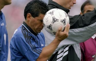 21 Jun 1994:  Diego Maradona of Argentina holds a soccer ball during a game against Greece. Mandatory Credit: Simon Bruty  /Allsport