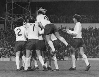 Tottenham Hotspur players congratulate Steve Perryman after his second goal against AC Milan in the UEFA Cup semi-final, first leg, at White Hart Lane, London, 5th April 1972. Spurs won the match 2-1. Among the players are: Joe Kinnear (in number 2 shirt), Alan Gilzean (7) and Ralph Coates (4). (Photo by Central Press/Hulton Archive/Getty Images)