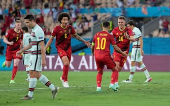 SEVILLE, SPAIN - JUNE 27: Thorgan Hazard of Belgium celebrates with Axel Witsel and Eden Hazard after scoring their side's first goal during the UEFA Euro 2020 Championship Round of 16 match between Belgium and Portugal at Estadio La Cartuja on June 27, 2021 in Seville, Spain. (Photo by Thanassis Stavrakis - Pool/UEFA via Getty Images)