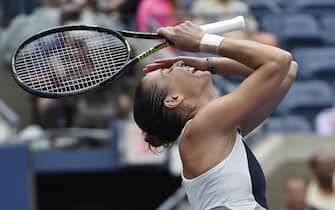 epa04925689 Flavia Pennetta of Italy reacts after defeating Simona Halep of Romania during their Semifinals round match on the twelfth day of the 2015 US Open Tennis Championship at the USTA National Tennis Center in Flushing Meadows, New York, USA, 11 September 2015. The US Open runs through 13 September, which is a return to a 14-day schedule.  EPA/JOHN G. MABANGLO