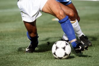 Four legs fighting for the ball. Italian midfielder Bruno Conti (front) and his Brazilian opponent Luizinho are engaged in a duel for the ball. The Italian national team wins their World Cup second round game against Brazil on 5 July 1982 at Sarria Stadium in Barcelona, Spain, by a score of 3-2. An important victory for Italy on their way to win the World Cup. (Photo by Melchert/picture alliance via Getty Images)