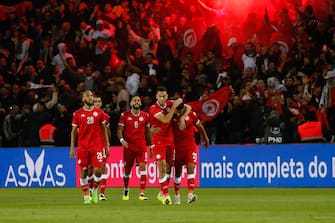 Tunisi's defender Montadha Ben Ouanes (2nd R) celebrates his equalizing goal with teammates during the Friendly football match between Brazil and Tunisia at Parc des Princes in Paris, FRANCE - 27/09/2022.