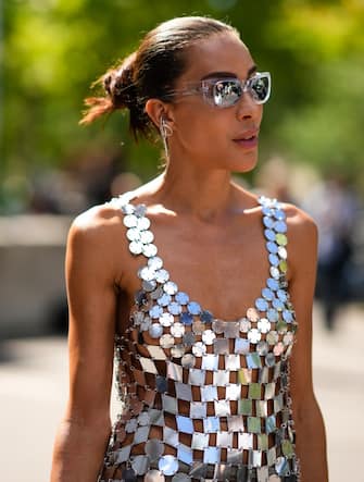 PARIS, FRANCE - JULY 03: Ines Rau wears sunglasses, a silver metallic circle and square V-neck / tank-top / backless / long dress from Paco Rabanne, outside the Paco Rabanne show, during Paris Fashion Week, on July 03, 2022 in Paris, France. (Photo by Edward Berthelot/Getty Images)
