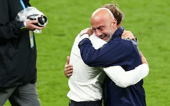 11 July 2021, United Kingdom, London: Football: European Championship, Italy - England, final round, final at Wembley Stadium. Football: European Championship, Italy - England, final round, final at Wembley Stadium. Italy coach Roberto Mancini (l) and Gianluca Vialli, head of the Italian national team delegation, hug after winning the penalty shootout. Photo: Christian Charisius/dpa