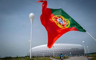epa09285847 A Portuguese national flag flies in front of the stadium before the UEFA EURO 2020 group F preliminary round soccer match between Portugal and Germany in Munich, Germany, 19 June 2021.  EPA/HUGO DELGADO (RESTRICTIONS: For editorial news reporting purposes only. Images must appear as still images and must not emulate match action video footage. Photographs published in online publications shall have an interval of at least 20 seconds between the posting.)