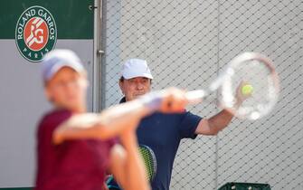 PARIS, FRANCE May 28. Jannik Sinner of Italy watched by coach Riccardo Piatti as he practices against Felix Auger-Aliassime of Canada on court three in preparation for the 2021 French Open Tennis Tournament at Roland Garros on May 28th 2021 in Paris, France. (Photo by Tim Clayton/Corbis via Getty Images)