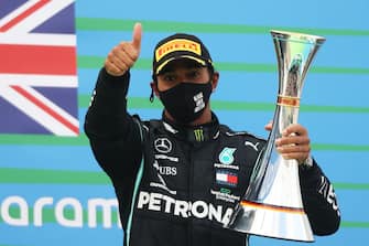 NUERBURG, GERMANY - OCTOBER 11: Race winner Lewis Hamilton of Great Britain and Mercedes GP celebrates on the podium during the F1 Eifel Grand Prix at Nuerburgring on October 11, 2020 in Nuerburg, Germany. (Photo by Wolfgang Rattay - Pool/Getty Images)