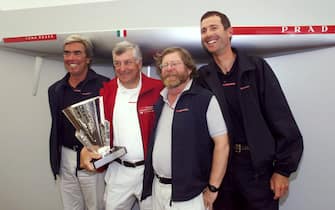 AUC02D:SPORT-YACHTING:AUCKLAND,NEWZEALAND,7FEB00 - Prada designer German Frerf lines up with syndicate head Patrizio Bertelli, design team member Doug Peterson and skipper Francesco de Angelis (L to R) February 7, the day after they won the Louis Vuitton Cup by beating AmericaOne 5-4. Prada won the best of nine series and now face New Zealand in the Americas Cup starting February 19, 2000.       nm/Photo by Nigel Marple       REUTERS