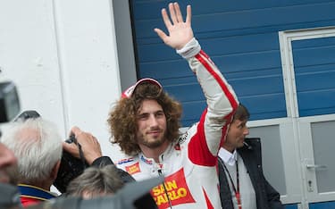 ESTORIL, PORTUGAL - APRIL 30: Marco Simoncelli of Italy and San Carlo Honda Gresini celebrates after the second position after the qualifying practice of MotoGP of Portugal in Estoril Circuit on April 30, 2011 in Estoril, Portugal.  (Photo by Mirco Lazzari gp/Getty Images)