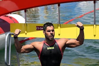 epa10043226 Dario Verani of Italy celerates his victory in men's open water 25km race of 19th FINA World Championships in Lake Lupa in Budakalasz, Hungary, 30 June 2022.  EPA/Zsolt Szigetvary HUNGARY OUT