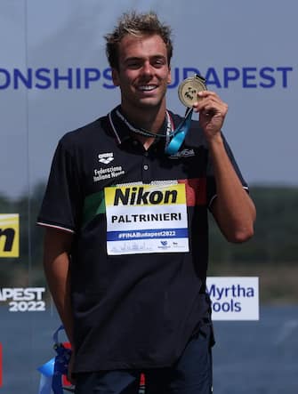 BUDAPEST, HUNGARY - JUNE 29: Gold medalist Gregorio Paltrinieri of Team Italy celebrates during the medal ceremony for the Open Water Men's 10km on day three of the Budapest 2022 FINA World Championships at Lake Lupa on June 29, 2022 in Budapest, Hungary. (Photo by Tom Pennington/Getty Images)
