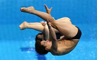 BUDAPEST, HUNGARY - JUNE 29: Chiara Pellacani and Matteo Santoro of Team Italy compete in the Mixed Synchronized 3m Springboard Final on day four of the Budapest 2022 FINA World Championships at Duna Arena on June 29, 2022 in Budapest, Hungary. (Photo by Quinn Rooney/Getty Images)