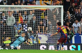 MADRID, SPAIN - APRIL 16:  Lionel Messi of Barcelona beats Real Madrid's goalkeeper Iker Casillas from the penalty spot to score Barcelona's opening goal  tduring the La Liga match between Real Madrid and Barcelona at Estadio Santiago Bernabeu on April 16, 2011 in Madrid, Spain.  (Photo by Denis Doyle/Getty Images)