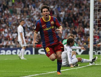MADRID, SPAIN - APRIL 27: Lionel Messi of Barcelona celebrates after scoring his first goal during the UEFA Champions League Semi Final first leg match between Real Madrid and Barcelona at Estadio Santiago Bernabeu on April 27, 2011 in Madrid, Spain. (Photo by Alex Livesey/Getty Images) 