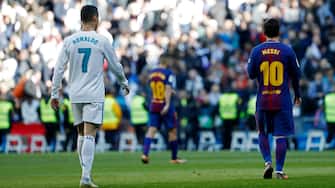 MADRID, SPAIN - DECEMBER 23: Cristiano Ronaldo of Real Madrid and Lionel Messi of Barcelona looks on during the La Liga match between Real Madrid and Barcelona at Estadio Santiago Bernabeu on December 23, 2017 in Madrid, Spain. (Photo by TF-Images/TF-Images via Getty Images)