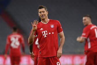 TOPSHOT - Bayern Munich's Polish forward Robert Lewandowski celebrates scoring from the penalty spot his team's forth goal to lead and win 4:3 during the German first division Bundesliga football match FC Bayern Munich vs Hertha Berlin on October 4, 2020 in Munich, southern Germany. (Photo by CHRISTOF STACHE / AFP) / DFL REGULATIONS PROHIBIT ANY USE OF PHOTOGRAPHS AS IMAGE SEQUENCES AND/OR QUASI-VIDEO (Photo by CHRISTOF STACHE/AFP via Getty Images)