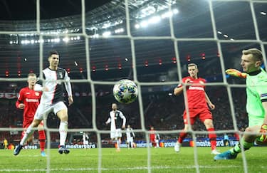 LEVERKUSEN, GERMANY - DECEMBER 11: Cristiano Ronaldo of Juventus scores his team's first goal during the UEFA Champions League group D match between Bayer Leverkusen and Juventus at BayArena on December 11, 2019 in Leverkusen, Germany. (Photo by Lars Baron/Getty Images)