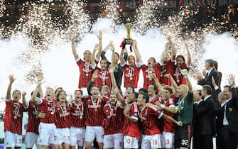 AC Milan players hold the Scudetto after winning the Italian football Serie A title on May 14, 2011 at San Siro stadium Milan. AC Milan claimed their 18th Serie A title.  AFP PHOTO / OLIVIER MORIN (Photo by Olivier MORIN / AFP) (Photo by OLIVIER MORIN/AFP via Getty Images)