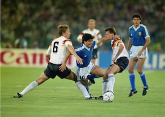 Argentinian striker Diego Maradona is challenged by Guido Buchwald (number 6), and Lothar Mattheus during the 1990 World Cup final at the Olimpico Stadium in Rome, 8th July 1990. West Germany won the match 1-0. (Photo by David Cannon/Getty Images)