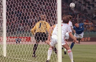 Italian forward Salvatore Schillaci (R) scores his team's first goal on a header past Czech goalkeeper Jan Stejsk during the World Cup first round soccer match between Italy and Czechoslovakia 19 June 1990 in Rome. Italy won 2-0.  AFP PHOTO/DANIEL GARCIA (Photo by DANIEL GARCIA / AFP)        (Photo credit should read DANIEL GARCIA/AFP via Getty Images)