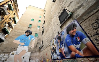 A 1990 mural representing Diego Maradona is pictured at the 'Maradona corner' at the top of the Quartieri Spagnoli on November 20, 2019 in Naples. - The Massimo Vignati Museum in Naples is unique in its kind. Neither it does appear on any map of the city, nor in travel guides, and entry is free of charge. And yet, all of Diego Maradona is there, in the basement of a typical building in Secondigliano, a hard neighborhood in the north of the city. (Photo by Alberto PIZZOLI / AFP) / TO GO WITH AFP STORY BY STANISLAS TOUCHOT (Photo by ALBERTO PIZZOLI/AFP via Getty Images)