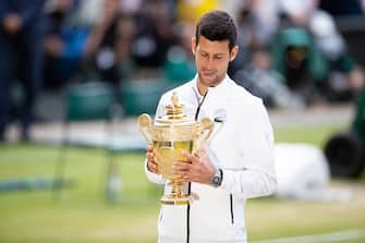 LONDON, ENGLAND - JULY 14: Novak Djokovic of Serbia with the winners trophy after defeating Roger Federer of Switzerland (not pictured)  in the Men's Singles Final  at The Wimbledon Lawn Tennis Championship at the All England Lawn and Tennis Club at Wimbledon on July 14, 2019 in London, England. (Photo by Simon Bruty/Anychance/Getty Images)