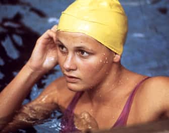 Portrait of Shane Gould from Australia, taken during a training session at the Munich Olympic Games, August 1972. Gould was the heroine of the Australian team as she set out to win five individual gold medals. She won golds in the 200m and 400m freestyle and 200m individual medley -all in world record times-, silver in the 800m freestyle and bronze in the 100m freestyle. In the 400m, she stormed home more than 3 seconds in front of the runner-up, Novella Calligaris of Italy. (Photo by - / AFP)        (Photo credit should read -/AFP via Getty Images)