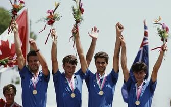 130820533 Marcello Bartalini, Marco Giovannetti, Eros Poli and Claudio Vandelli of Italy celebrate their gold medal placing in the Men's 100 kilometres Team Time Trial on 5th August 1984 during the XXIII Olympic Summer Games at the Artesia Freeway, Buena Park, California, United States. (Photo by David Cannon/Getty Images)