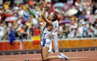 Maratoneta Alex Schwazer of Italy fall to his knees and celebrates as he wins gold in the men's 50km walk during the Beijing 2008 Olympic Games in the National Stadium, Beijing, China, 22 August 2008.
ANSA/FRANCK ROBICHON