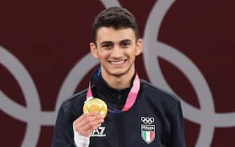 Italy's Vito Dell'Aquila celebrate his gold medal, first for Italy, after won the final match against Tunisia's Khalil Mohamed Jendoubi during Taekwondo Men's -58kg of the Tokyo 2020 Olympic Games at the Makuhari Messe convention centre in Chiba, Japan, 24 July 2021. ANSA / CIRO FUSCO