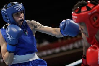 Philippines' Nesthy Petecio (red) and Italy's Irma Testa fight during their women's feather (54-57kg) semi-final boxing match during the Tokyo 2020 Olympic Games at the Kokugikan Arena in Tokyo on July 31, 2021. (Photo by UESLEI MARCELINO / POOL / AFP) (Photo by UESLEI MARCELINO/POOL/AFP via Getty Images)