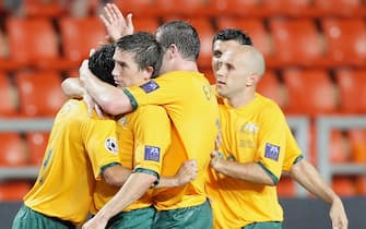BANGKOK, THAILAND - JULY 08:  Tim Cahill of Australia celebrates with teammates after he scored a goal to equalise the game during the AFC Asian Cup 2007 group A match between Australia and Oman at the Rajamangala Nation Stadium on July 8, 2007 in Bangkok, Thailand.  (Photo by Robert Cianflone/Getty Images)