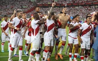 epa09859874 Peru players celebrate at the end of a soccer match of the South American qualifiers for the Qatar 2022 World Cup between Peru and Paraguay, at the National Stadium in Lima, Peru, 29 March 2022.  EPA/Paolo Aguilar