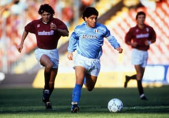 1990-91 Diego Armando Maradona (R) of SSC Napoli competes for the ball with Giuseppe Carillo of Torino during the Serie A match between Torino and SSC Napoli on Stadio Comunale Torino , Italy.  (Photo by Alessandro Sabattini/Getty Images)
