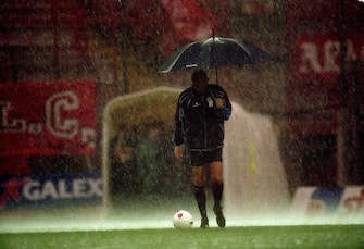 14 May 2000:  Referee Pierluigi Collina tests waterlogged pitch during the Italian Serie A match between Perugia and Juventus at the Stadio Curi A, in Perugia, Italy. Perugia won the match 1-0. \ Mandatory Credit: Claudio Villa /Allsport