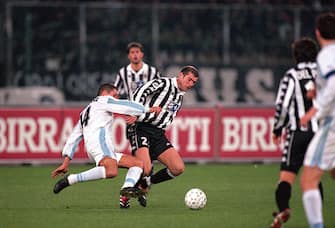 1 Apr 2000:  Zinedine Zidane of Juventus holds the ball from Diego Simeone of Lazio during the Italian Serie A match played at the Stadio Delle Alpi in Turin, Italy. Lazio won the match 1-0. \ Mandatory Credit: Claudio Villa /Allsport