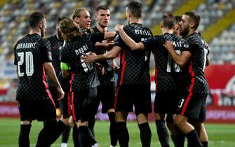 Croatia's forward Ivan Perisic is congratulated by team mates after scoring a goal during qualification football match for the FIFA World Cup Qatar 2022 between Croatia and Malta at the Rujevica stadium in Rijeka on March 30, 2021. (Photo by Denis LOVROVIC / AFP) (Photo by DENIS LOVROVIC/AFP via Getty Images)