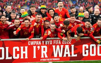 Wales' Gareth Bale (centre) celebrates with team-mates and staff after qualifying for the Qatar World Cup following victory in the FIFA World Cup 2022 Qualifier play-off final match at Cardiff City Stadium, Cardiff. Picture date: Sunday June 5, 2022. (Photo by David Davies/PA Images via Getty Images)