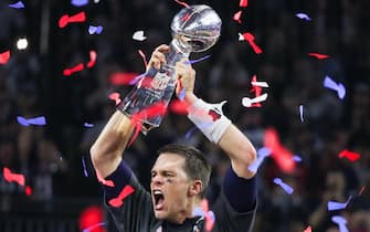 New England Patriots quarterback Tom Brady (#12) holds up the Vince Lombardi Trophy during the post game ceremony for Super Bowl LI  after the New England Patriots defeated the Atlanta Falcons 34-28 in overtime held at the NRG Stadium on February 5, 2017 in Houston, TX. (Photo by Anthony Behar) *** Please Use Credit from Credit Field ***